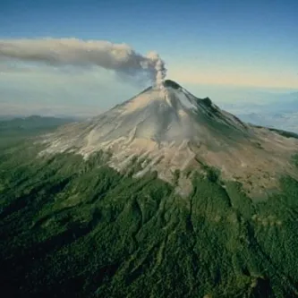 A plume of steam and ash rises above Popocatépetl