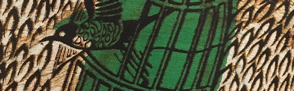 a bird flying out of a cage