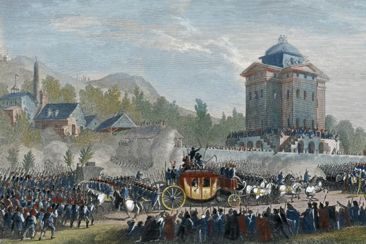 A horse-drawn carriage passes through a crowd in front of a tower