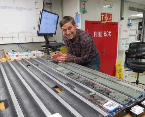 A scientist with the core table onboard the JOIDES Resolution.