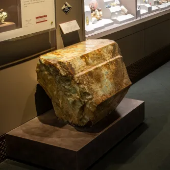 Large blue, brown, and white stone with six flat sides.