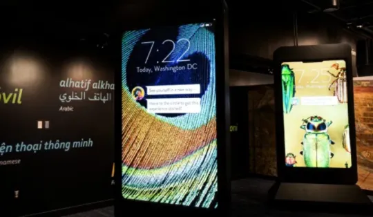 Giant cellphones greet visitors to the exhibit