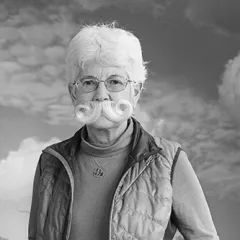 focus on Kay's face wearing a beard 