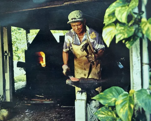 Photo of a man working at a blacksmith's forge